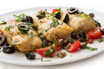 Filetti di merluzzo alla mediterranea, boiled cod fillets with black olives, capers and tomatoes