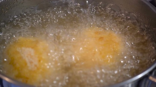 Home cooking of italian traditional dish arancini in slow motion
