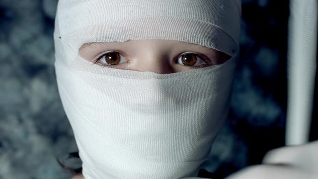 4k Dramatic Shot of a Sick Child and Doctor Taking off Bandages from Head