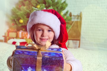 Obraz na płótnie Canvas Child giving a christmas present.
