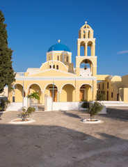 Fototapeta na wymiar St George Church in Oia village on Santorini island, Greece