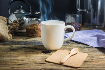 Focus spot, Cup of hot coffee on the old wooden table. In the morning coffee in the kitchen. Welcome the new day.