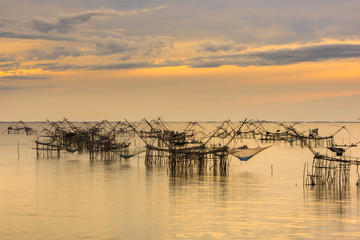 Fototapeta premium Umbrella Dip Nets with sunrise, Pakpra, Phattalung, Thailand