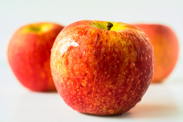Red apples on white background.