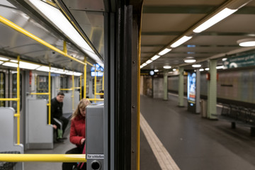 People in subway train (U-Bahn) at metro train station
