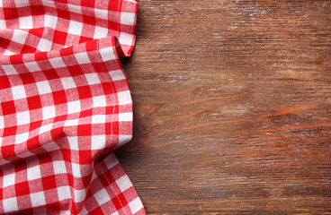 Fototapeta na wymiar Red napkin on wooden table