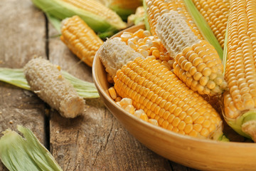 Corncobs and seeds in plate on table, closeup