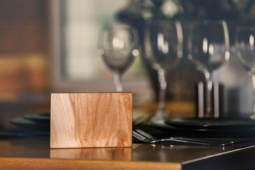 Wooden sign on table in cafe