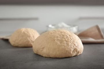 Fototapeta na wymiar Raw dough on kitchen table