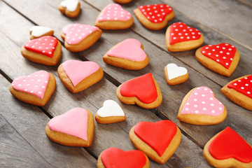 Valentine's day cookies on wooden background, closeup