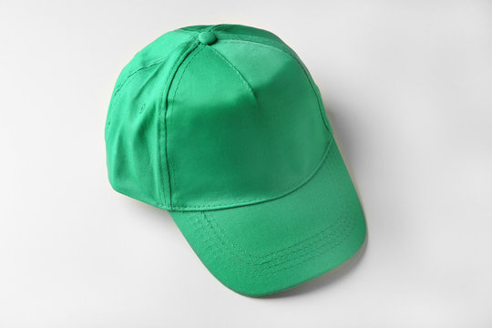 Blank green baseball cap on white background