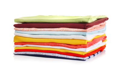Stack of colorful clothes on white background, closeup