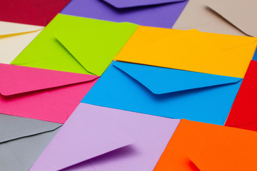 Different colored envelopes on the desk