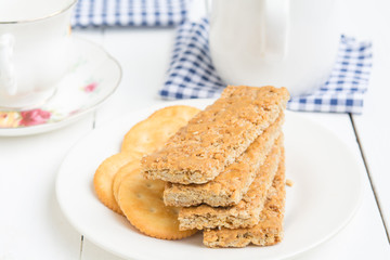Peanut Butter Cookies and bread in white plate on food table