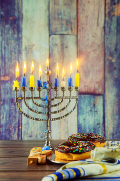 Jewish Holiday  symbol Hanukkah background with menorah