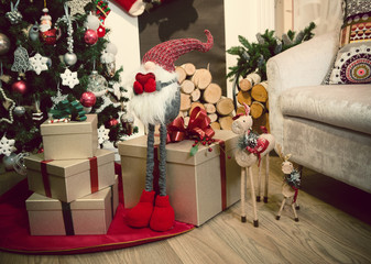 Obraz premium Christmas tree by the fireplace close up