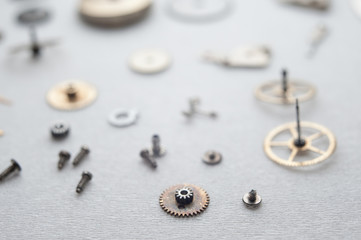 Detail of watch machinery on the table.