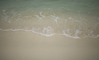 Waves run on the sand, tropics.