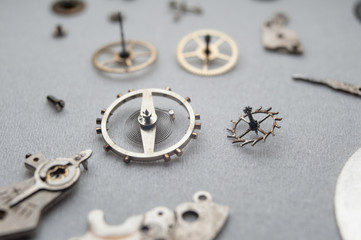 Detail of watch machinery on the table.
