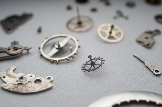 Detail of watch machinery on the table.