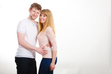 Happy enamoured couple hugging each other.