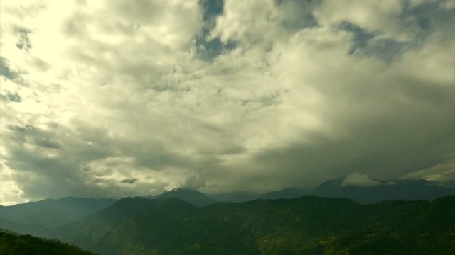 Beautiful time lapse stock footage of clouds passing over Himalayan mountains, Sikkim, India. Day ends in evening video with HD, 1920 x 1020 quality, filtered nature video.