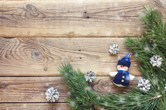 Christmas background with border of fir branches and miniature s