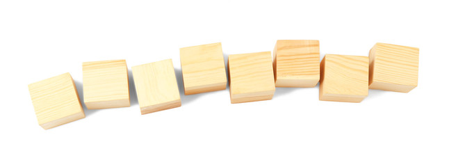 Empty wooden cubes on white background