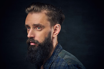 Bearded male with long hair.