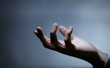 Businessman hand  on dark background