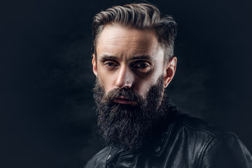 Bearded male with long hair.