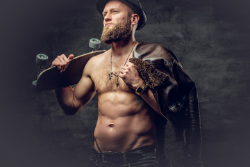 Fototapeta na wymiar Bearded man wearing a leather jacket on naked torso.