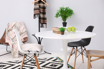 Neutral interior with table on gray wall background