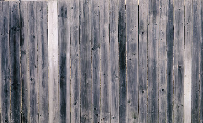 Fototapeta na wymiar Old wooden fence in village