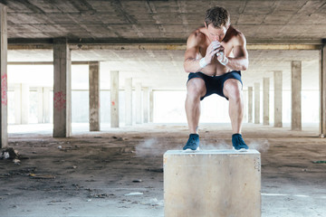 Man doing box jumps