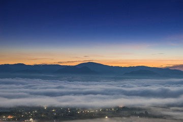 Sunrise and sea of clouds over Pai District Mae Hong Son, THAILAND. View from Yun Lai Viewpoint is...