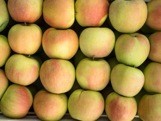 Background of green and red apples close up. Green and red apples pattern on sale at the market.