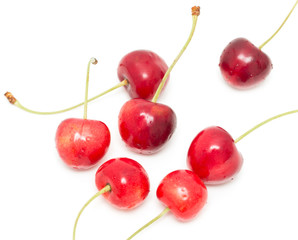 red cherries on a white background