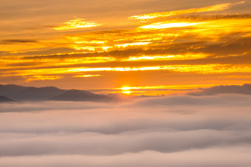 Fototapeta na wymiar Sunrise and sea of clouds over Pai District Mae Hong Son, THAILAND. View from Yun Lai Viewpoint is located about 5 km to the West of Pai town centre above the Chinese Village.