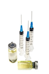Three upright standing transparent medical syringes without needle caps, Medical ampule with medicament  lying near. One more vial standing.Isolated on White background. Vertical.
