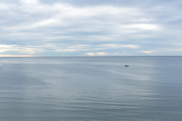 Top view cloud scape and ocean with fishing boat