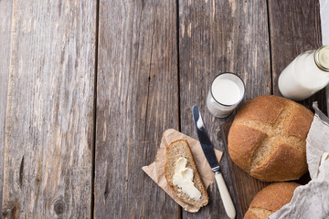 Rustic breakfast with wholegrain bread, milk and butter