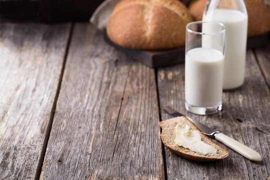 Rustic breakfast with wholegrain bread, milk and butter