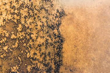 Frosty pattern on glass at sunset or sunrise