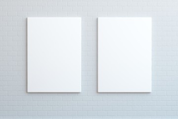 `Two white posters hanging on the wall, mock up