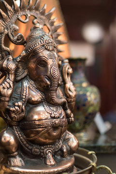 Small metal statuette of Ganesha, a Hindu god with elephant head