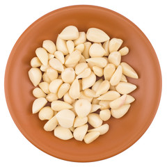 Garlic cloves in plate from top including clipping path.