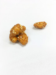 Peanut coat sugar on the white background