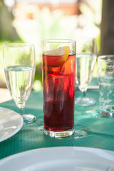 wine with soda tall glass on green tablecloth