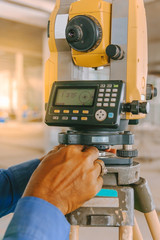 Surveyor equipment tacheometer or theodolite outdoors at construction site